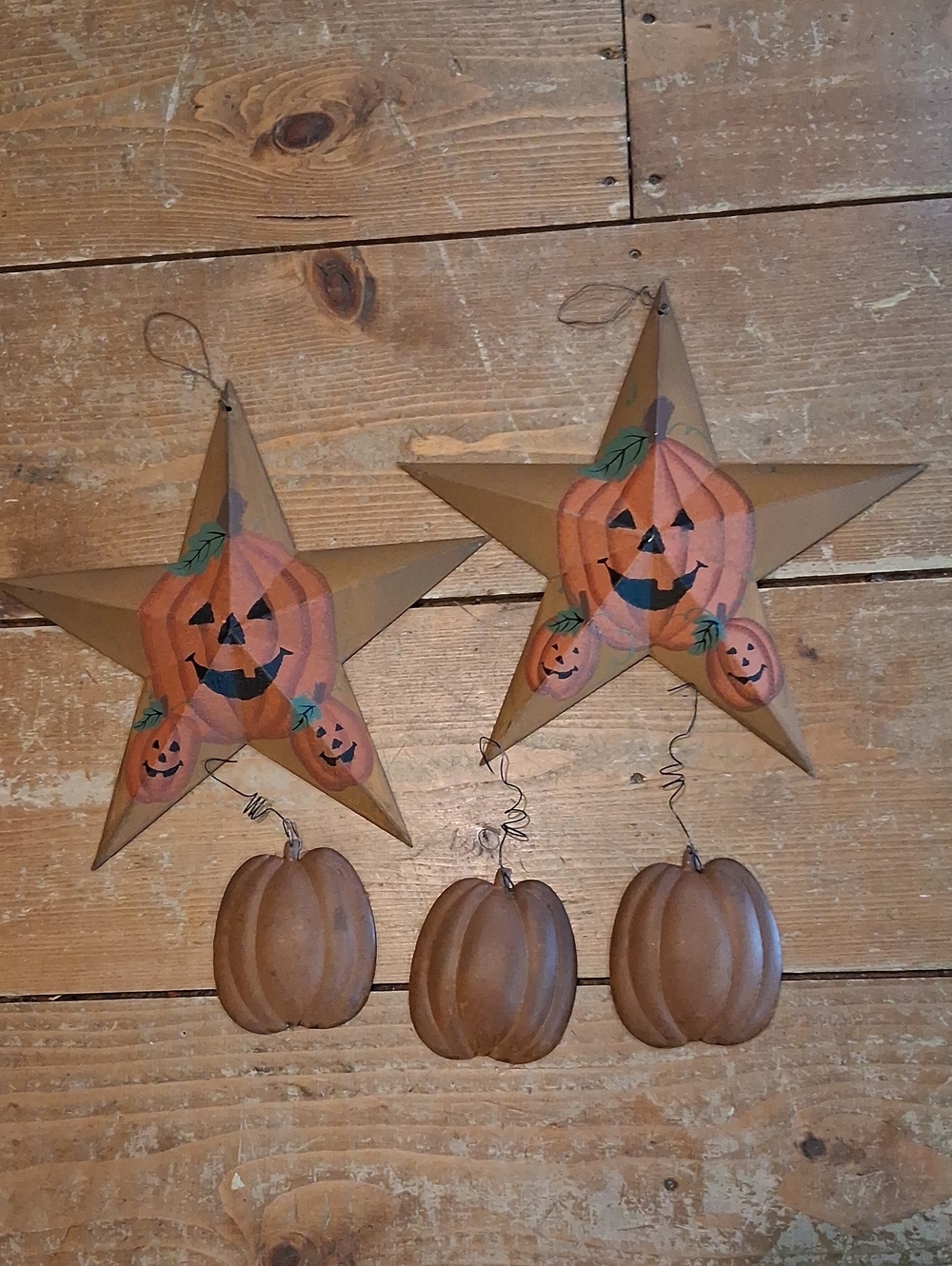 Rusty Fall stars with jack-o-lanterns and hanging pumpkin decorations